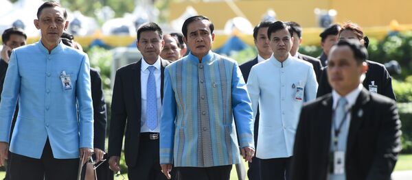 Prime Minister Prayuth Chan-Ocha (C) arrives at Government House before a cabinet meeting in Bangkok on August 9, 2016 Prime Minister Prayuth Chan-Ocha (C) arrives at Government House before a cabinet meeting in Bangkok on August 9, 2016 - Sputnik International