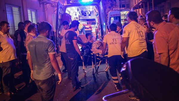 First aid officers carry an injured man to hospital August 20, 2016 in Gaziantep following a late night militant attack on a wedding party in southeastern Turkey - Sputnik International