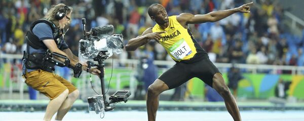 2016 Rio Olympics - Athletics - Final - Men's 200m Final - Olympic Stadium - Rio de Janeiro, Brazil - 18/08/2016. Usain Bolt (JAM) of Jamaica poses after winning the gold 2016 Rio Olympics - Athletics - Final - Men's 200m Final - Olympic Stadium - Rio de Janeiro, Brazil - 18/08/2016. Usain Bolt (JAM) of Jamaica poses after winning the gold - Sputnik International