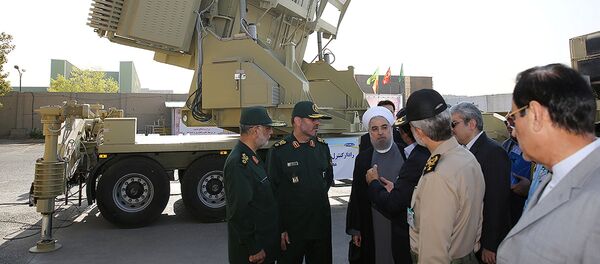 Iran's President Hassan Rouhani (3rd L) and Iranian Defence Minister Hossein Dehghan (2nd L) stand in front of the new air defense missile system Bavar-373, in Tehran, Iran August 21, 2016 - Sputnik International