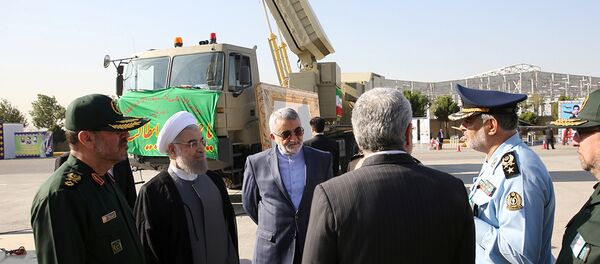 Iran's President Hassan Rouhani (2nd L) and Defence Minister Hossein Dehghan (L) stand near the new air defense missile system Bavar-373, in Tehran, Iran August 21, 2016 - Sputnik International