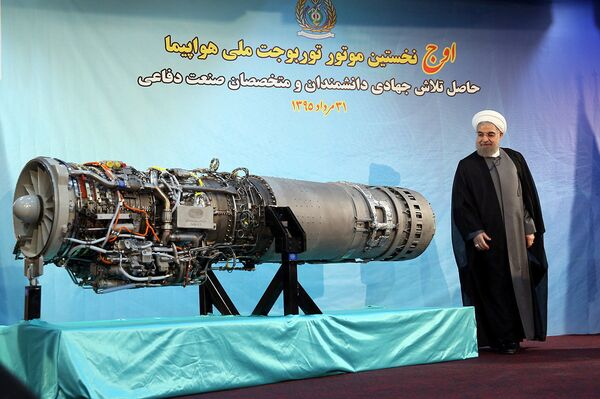 Iran's President Hassan Rouhani stands next to an Iranian-made fighter jet engine, in Tehran, Iran August 21, 2016 Iran's President Hassan Rouhani stands next to an Iranian-made fighter jet engine, in Tehran, Iran August 21, 2016 - Sputnik International