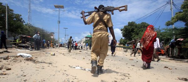 A Somali policeman walks towards the scene of an explosion (File) - Sputnik International