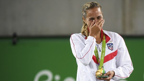 2016 Rio Olympics - Tennis - Victory Ceremony - Women's Singles Victory Ceremony - Olympic Tennis Centre - Rio de Janeiro, Brazil - 13/08/2016. Gold medalist Monica Puig (PUR) of Puerto Rico reacts after receiving her medal - Sputnik International