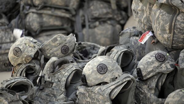Helmets and body armor are are stacked and ready to go outside the passenger terminal at Sather Air Base in Baghdad, Iraq, for U.S. Army soldiers from the 3rd Armored Cavalry Regiment to begin their journey home to the United States after a yearlong deployment (File) - Sputnik International