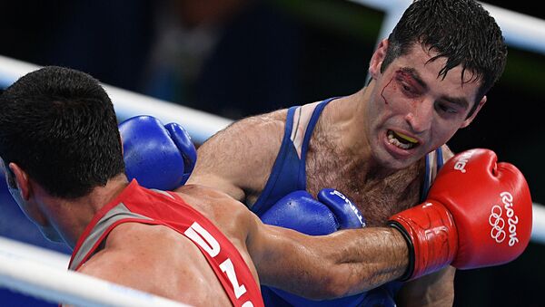 From right: Misha Aloyan (Russia) and Shakhobiddin Zairov (Uzbekistan) during the final bout of the men’s boxing in the 52kg division at the XXXI Summer Olympics - Sputnik International