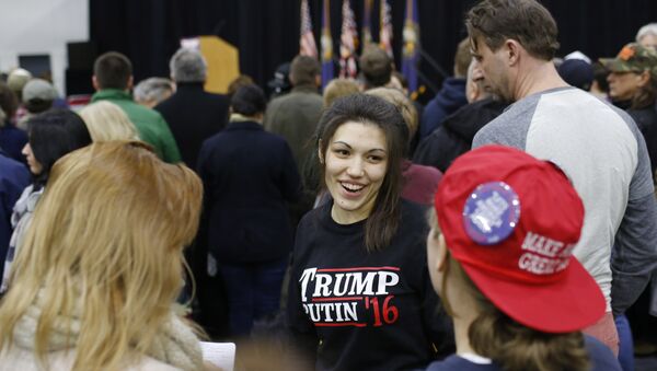 A woman wears a shirt reading Trump-Putin '16 before a rally for Republican presidential candidate Donald Trump at Plymouth State University, February 7, 2016, in Plymouth, New Hampshire - Sputnik International