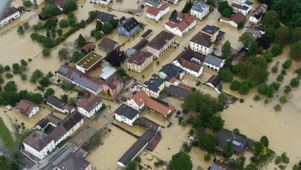 An aerial view shows the flooded streets and damages in Simbach am Inn, southern Germany, Thursday June 2, 2016 - Sputnik International