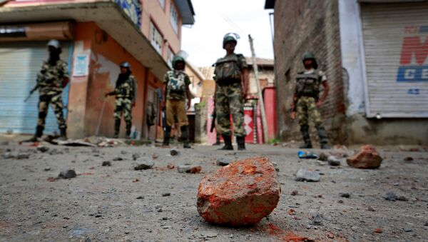 Stones thrown by protestors litter the street in Srinagar as security forces enforce a curfew following weeks of violence in Kashmir, August 18, 2016 - Sputnik International
