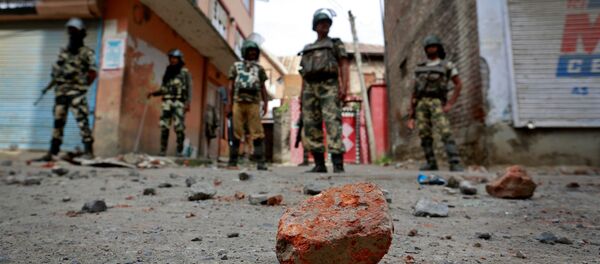 Stones thrown by protestors litter the street in Srinagar as security forces enforce a curfew following weeks of violence in Kashmir, August 18, 2016 Stones thrown by protestors litter the street in Srinagar as security forces enforce a curfew following weeks of violence in Kashmir, August 18, 2016 - Sputnik International