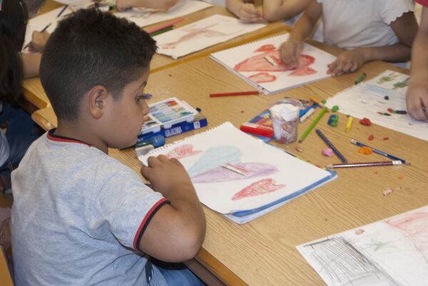 A Syrian boy is seen attending a drawing circle in Damascus A Syrian boy is seen attending a drawing circle in Damascus - Sputnik International