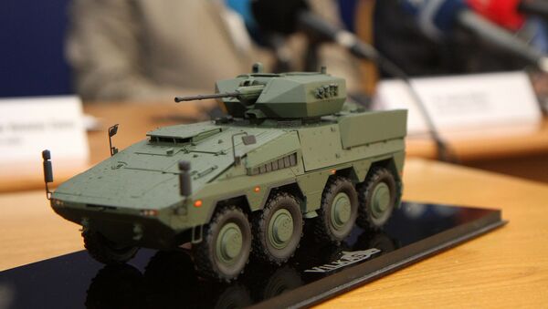 A model of the Boxer infantry fighting vehicles (IFV) is pictured during a press conference at the Ministry of National Defence in Vilnius, Lithuania, on August 22, 2016 - Sputnik International