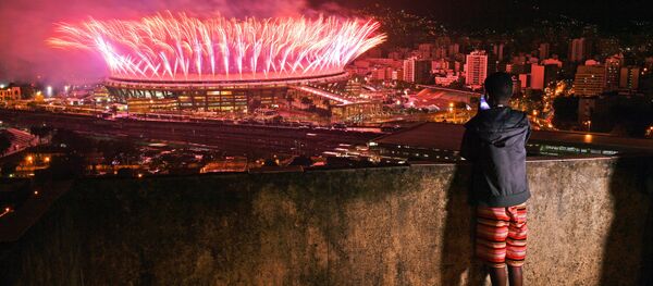 A boy from Mangueira favela watch fireworks over Maracana Stadium during the 2016 Olympics closing ceremony in Rio de Janeiro on August 21, 2016 A boy from Mangueira favela watch fireworks over Maracana Stadium during the 2016 Olympics closing ceremony in Rio de Janeiro on August 21, 2016 - Sputnik International