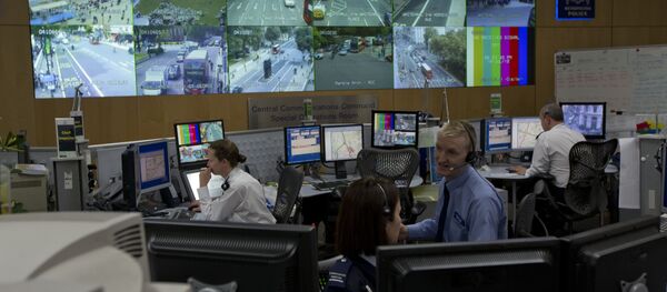 A member of police staff stands in front of CCTV screens in London's Metropolitan Police Service Special Operations Room in central London (File) A member of police staff stands in front of CCTV screens in London's Metropolitan Police Service Special Operations Room in central London (File) - Sputnik International
