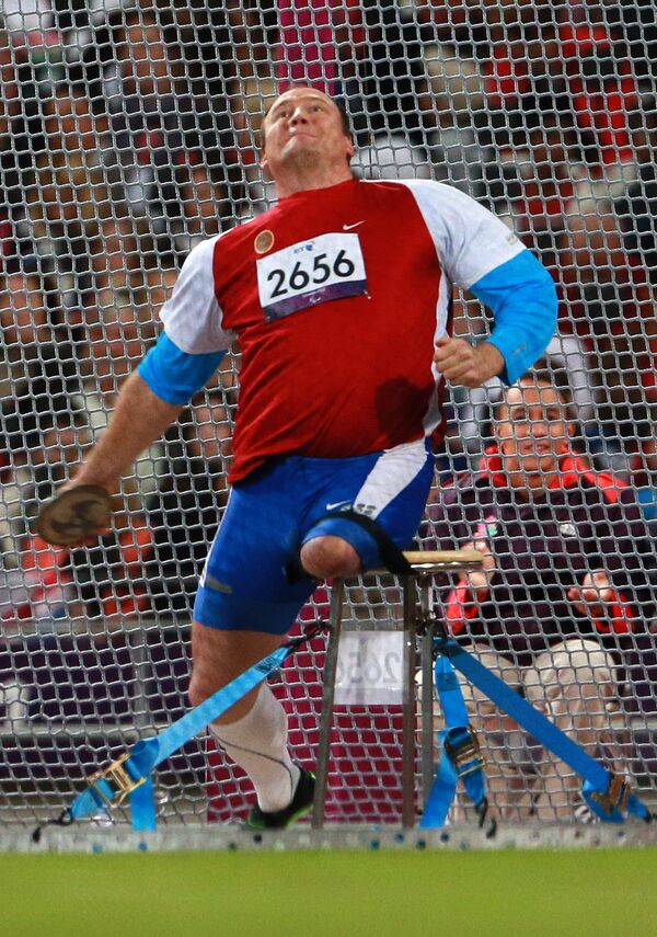 Russian wheelchair athlete Alexei Ashapatov during the discus throw event at the 2012 London Paralympics. He won the gold medal and set a new world record Russian wheelchair athlete Alexei Ashapatov during the discus throw event at the 2012 London Paralympics. He won the gold medal and set a new world record - Sputnik International