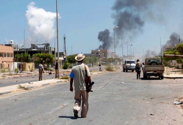 Smoke rises during a battle between Libyan forces allied with the U.N.-backed government and Islamic State fighters in neighborhood Number Two in Sirte, Libya August 16, 2016 Smoke rises during a battle between Libyan forces allied with the U.N.-backed government and Islamic State fighters in neighborhood Number Two in Sirte, Libya August 16, 2016 - Sputnik International