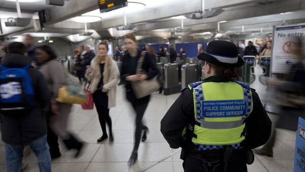 A British Transport Police Community Support officer stands by the barriers at Westminster underground train station in London, Monday, Dec. 7, 2015 - Sputnik International