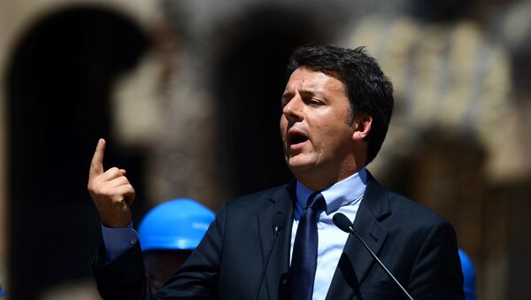 This file photo taken on July 1, 2016 shows Italian Prime Minister Matteo Renzi speaking during a press conference in Rome to announce the end of the restoration of the façade of the Colosseum financed by top luxury brands - Sputnik International