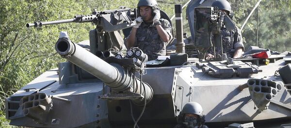 South Korean army soldiers ride a K-1 tank during the annual exercise in Paju, South Korea, near the border with North Korea - Sputnik International