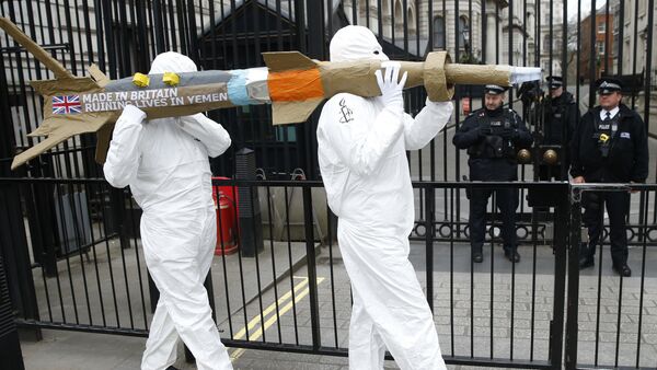 Amnesty International members protest by carrying a mock up of a missile, against the British Government's continued sale of arms to Saudi Arabia outside Downing Street in London, Friday, March,18, 2016 - Sputnik International