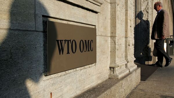 The shadow of a sculpture is reflected on the World Trade Organisation, WTO sign near the entrance of the headquarters, in Geneva (File) - Sputnik International