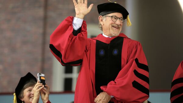 Filmmaker Steven Spielberg waves as he acknowledges applause before receiving an honorary doctor of arts degree during Harvard University commencement exercises, Thursday, May 26, 2016, in Cambridge, Mass - Sputnik International