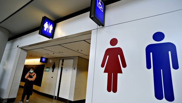 A woman wearing a mask walks out of the toilets. Hong Kong (File) - Sputnik International