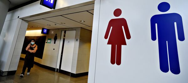 A woman wearing a mask walks out of the toilets. Hong Kong (File) - Sputnik International