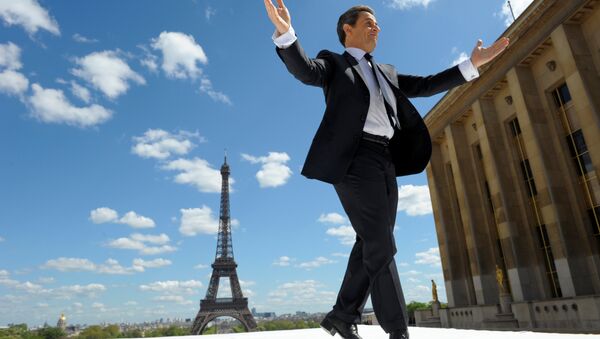 France's President and UMP party candidate for his re-election in the 2012 French presidential elections, Nicolas Sarkozy waves to supporters as he arrives on stage at Trocadero square to deliver a speech during a campaign rally in front the Eiffel Tower in Paris, France May 1, 2012. - Sputnik International