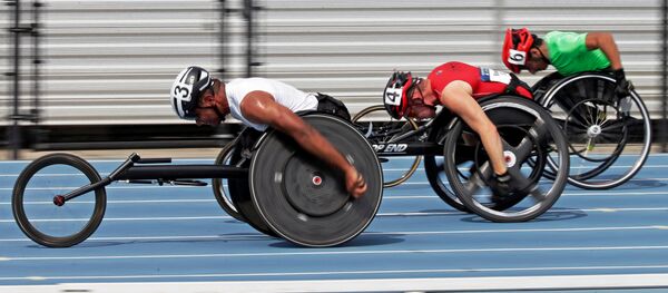 Casey Followay, left, Stephen Binning, center, and Arturo Torres, right, race in their heat in the men's 100-meter dash during the U.S. Paralympics Team Trials in Charlotte, N.C., Friday, July 1, 2016. Casey Followay, left, Stephen Binning, center, and Arturo Torres, right, race in their heat in the men's 100-meter dash during the U.S. Paralympics Team Trials in Charlotte, N.C., Friday, July 1, 2016. - Sputnik International