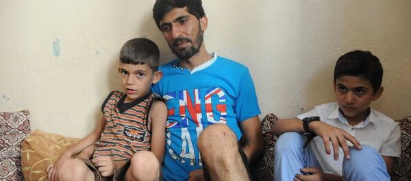 Ahmet Abdullah, whose daughter Fatma was killed in the suicide bombing attack in Gaziantep, with his two sons. Ahmet Abdullah, whose daughter Fatma was killed in the suicide bombing attack in Gaziantep, with his two sons. - Sputnik International