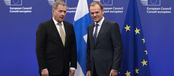 European Union President Donald Tusk (R) poses with Finnish President Sauli Niinisto before their bilateral meeting on January 21, 2015 at the EU Headquarters in Brussels. - Sputnik International