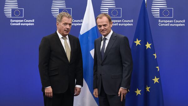 European Union President Donald Tusk (R) poses with Finnish President Sauli Niinisto before their bilateral meeting on January 21, 2015 at the EU Headquarters in Brussels. - Sputnik International