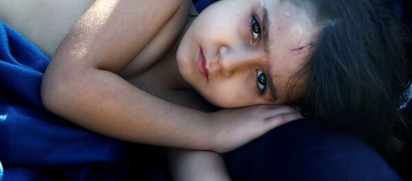 Syrian refugee girl Housaida rests inside the Spanish rescue vessel Astral after being rescued by the Spanish NGO Proactiva off the Libyan coast in the Mediterranean Sea August 18, 2016. Syrian refugee girl Housaida rests inside the Spanish rescue vessel Astral after being rescued by the Spanish NGO Proactiva off the Libyan coast in the Mediterranean Sea August 18, 2016. - Sputnik International