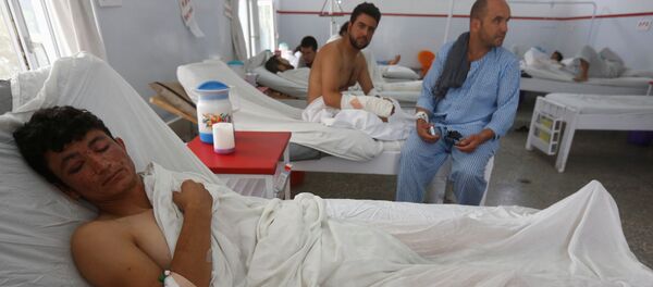 A wounded Afghan man, who survived last night's attack at American University of Afghanistan, receives treatment at the Emergency Hospital in Kabul, Afghanistan August 25, 2016. - Sputnik International
