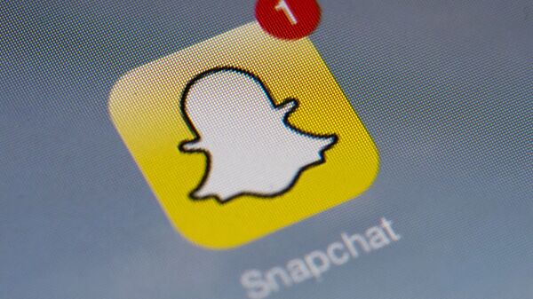 The logo of mobile app Snapchat is displayed on a tablet on January 2, 2014 in Paris. - Sputnik International
