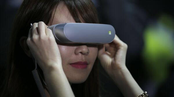 In this Sunday, Feb. 21. 2016, file photo, a woman uses LG 360 VR glasses during the LG unpacked 2016 event on the eve of the week's Mobile World Congress wireless show, in Barcelona, Spain - Sputnik International