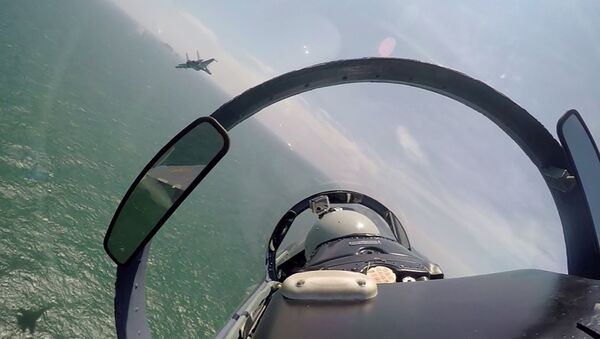 In this undated photo released Saturday, Aug. 6, 2016, by China's Xinhua News Agency, a pair of Chinese fighter jets fly during a patrol over the South China Sea - Sputnik International