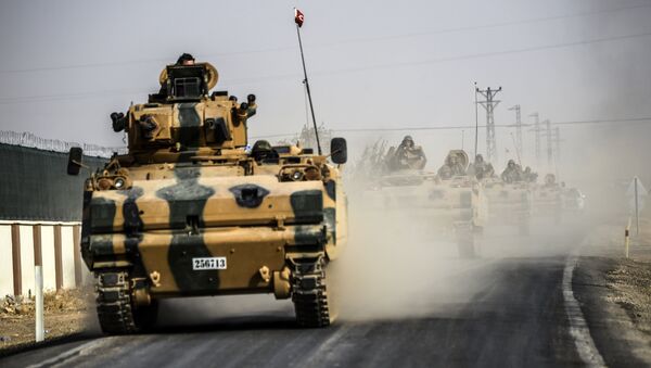 This picture taken around 5 kilometres west from the Turkish Syrian border city of Karkamis in the southern region of Gaziantep, on August 25, 2016 shows Turkish Army tanks driving to the Syrian Turkish border town of Jarabulus - Sputnik International