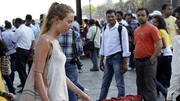 In this Tuesday, April 2, 2013 photo, German tourist Carolina De Paola, 22, walks near the landmark Gateway of India in Mumbai, India - Sputnik International