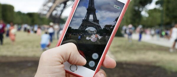 This file photo taken on July 26, 2016 shows the 'Pokemon Go' app on the screen of a smartphone, in Paris, on July 26, 2016 - Sputnik International