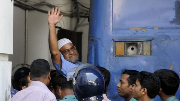 This file photograph taken on November 2, 2014, shows Bangladeshi Jamaat-e-Islami party leader, Mir Quasem Ali waving as he enters a van at the International Crimes Tribunal court in Dhaka - Sputnik International