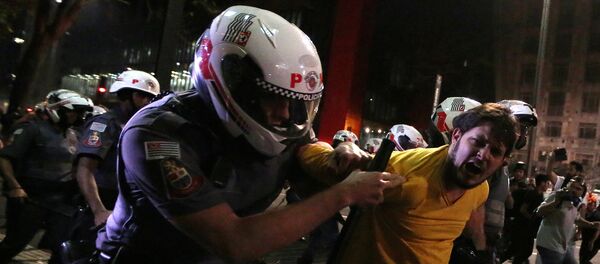 A man is detained by riot police during a protest by supporters of Brazil's suspended President Dilma Rousseff at Paulista avenue in Sao Paulo, Brazil, August 29, 2016 - Sputnik International