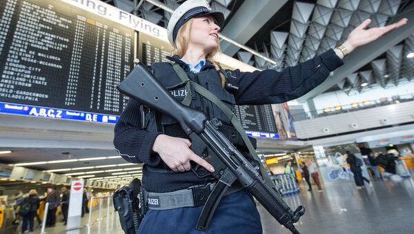 An armed policewoman gestures in Frankfurt Airport, on March 22, 2016, in Frankfurt, western Germany - Sputnik International