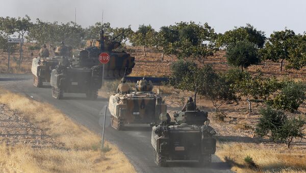 Turkish armoured personnel carriers drive towards the border in Karkamis on the Turkish-Syrian border in the southeastern Gaziantep province, Turkey, August 27, 2016 - Sputnik International