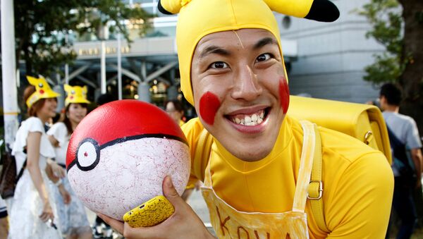 A man wearing Pokemon's character Pikachu costume - Sputnik International