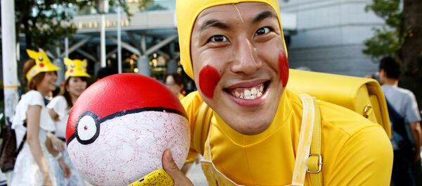 A man wearing Pokemon's character Pikachu costume - Sputnik International