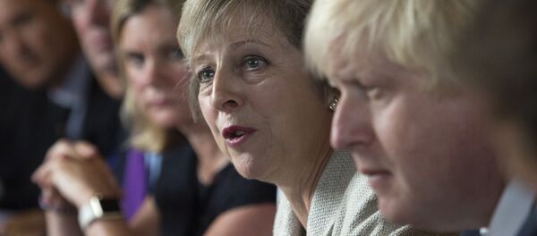 Britain's Prime Minister Theresa May (2R) speaks as she chairs a cabinet meeting sat next to British Foreign Secretary Boris Johnson (R) at the Prime Minister's country retreat Chequers near the village of Ellesborough in Buckinghamshire, northwest of London, on August 30, 2016. - Sputnik International