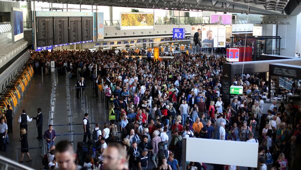 People gather at Frankfurt airport terminal after Terminal 1 departure hall was evacuated in Frankfurt, Germany, August 31, 2016 - Sputnik International