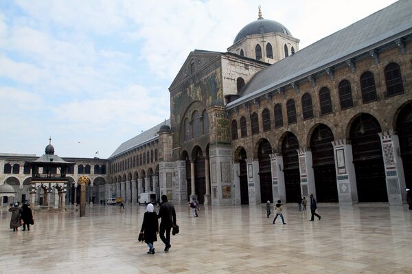 Syrian Muslims walk in the courtyard of the historic Umayyad Mosque before weekly prayers in Damascus, Syria. File photo Syrian Muslims walk in the courtyard of the historic Umayyad Mosque before weekly prayers in Damascus, Syria. File photo - Sputnik International
